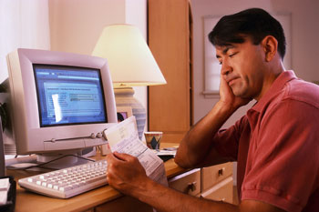 Man on home computer - Home IT consulting services for your home network issues